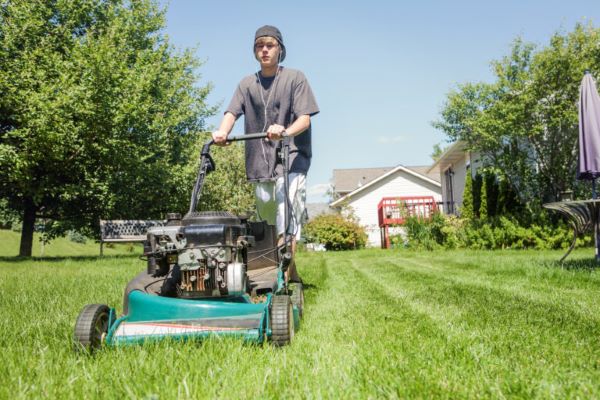 teen mowing yard teen mowing yard